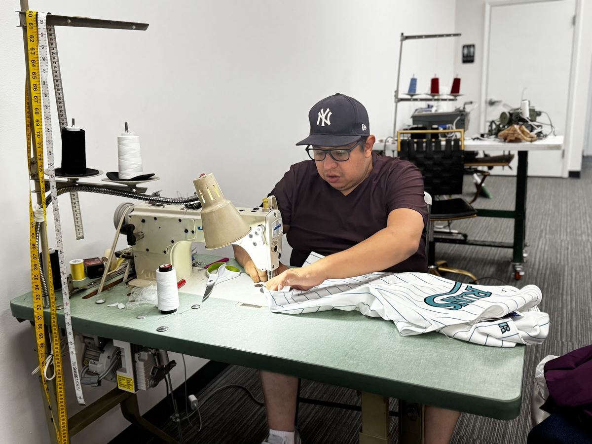 Efrain at his sewing station in Doral
